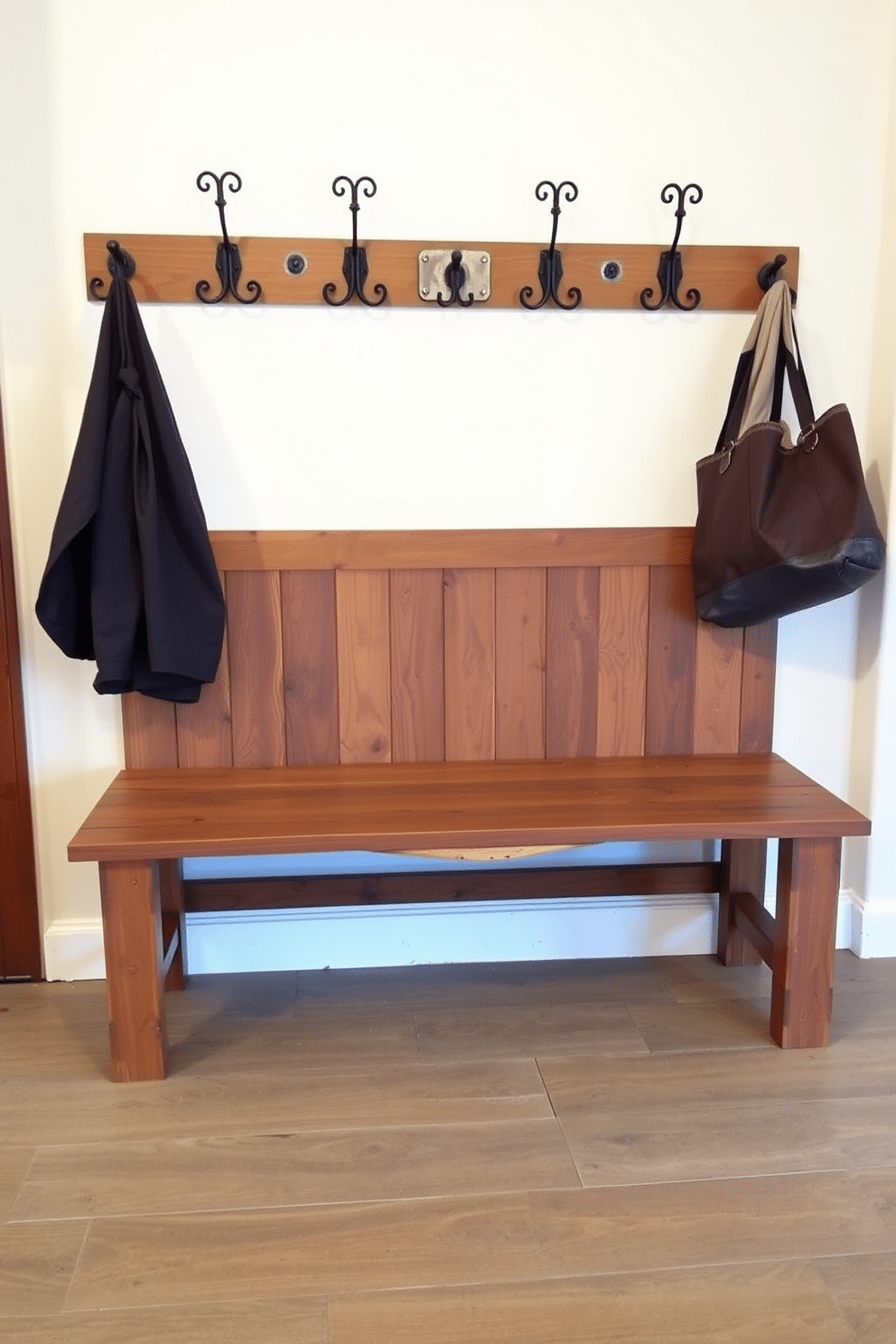 A rustic mudroom features a sturdy wooden bench adorned with plush, patterned cushions for comfort. The space is designed with reclaimed wood accents, a sliding barn door, and hooks for hanging coats, creating a warm and inviting atmosphere.