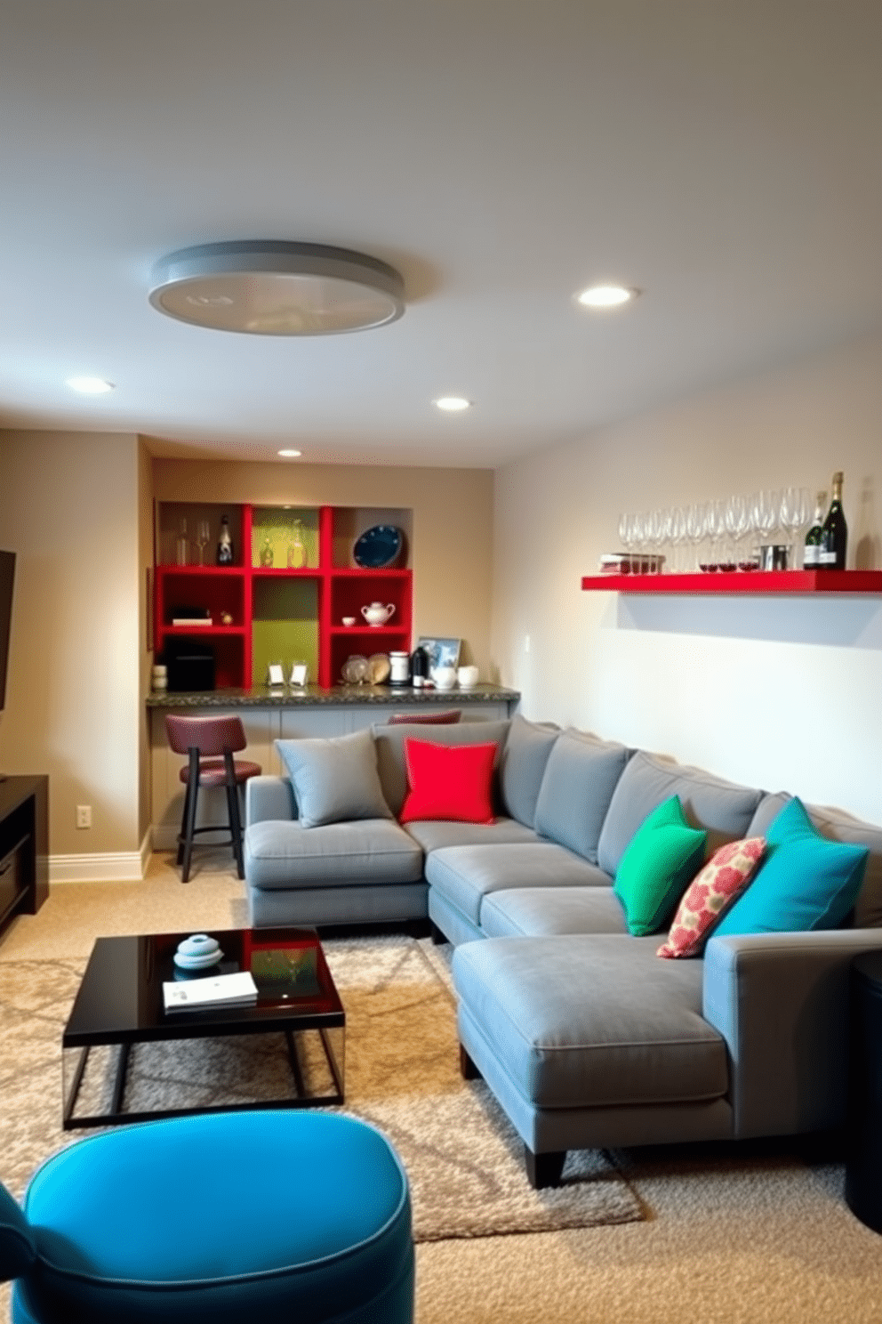 A cozy basement living area featuring an accent wall painted in a vibrant teal, contrasting with the soft beige walls surrounding it. The space includes a plush sectional sofa adorned with colorful throw pillows, and a sleek coffee table sits atop a warm area rug. In one corner, a small bar area showcases bold red shelves filled with glassware and decorative items. Soft lighting highlights the playful decor, creating an inviting atmosphere perfect for relaxation and entertainment.