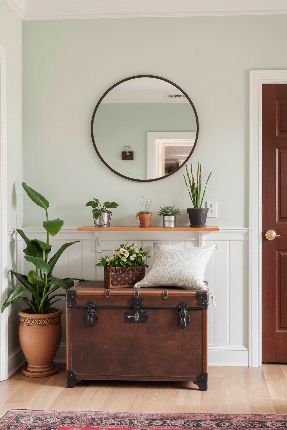 A charming entryway features a vintage trunk serving as both a stylish storage solution and a decorative piece. The walls are painted in a soft pastel hue, complemented by a round mirror above the trunk, creating an inviting atmosphere. Incorporating a small bench beside the trunk provides a functional seating area. A collection of potted plants adds a touch of greenery, while a patterned rug anchors the space and adds warmth.