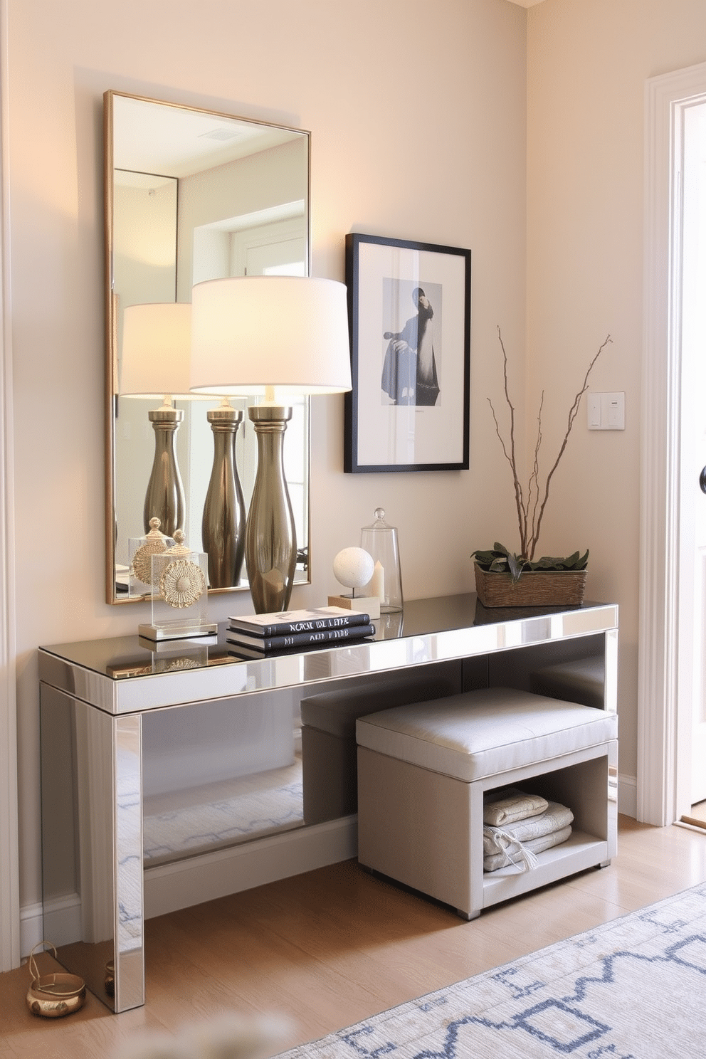 A sleek mirrored console table reflects light and creates a sense of spaciousness in a small entryway. The table is adorned with a stylish lamp and a few decorative items, enhancing the inviting atmosphere. To the side, a compact bench with built-in storage offers a practical seating solution while maintaining a clutter-free look. Soft, warm lighting illuminates the space, highlighting the elegant details of the decor.