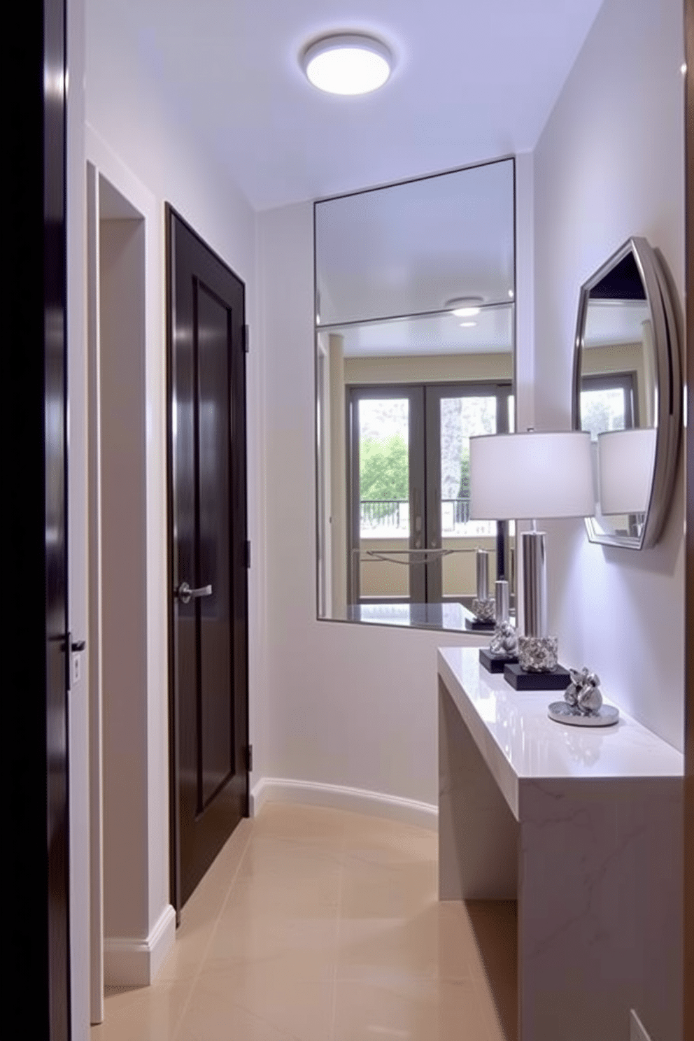 A small entryway features mirrored accents that beautifully reflect light, creating an illusion of a larger space. The walls are painted in a soft, neutral tone, while a sleek console table with a glossy finish sits against one side, adorned with decorative items and a stylish lamp.