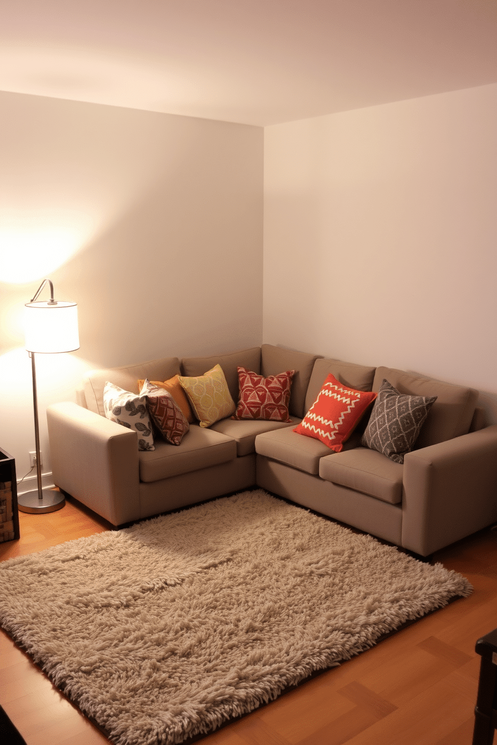 A cozy sectional sofa is positioned in the center of a small family room, adorned with an array of colorful throw pillows that add a playful touch. Soft, ambient lighting from a stylish floor lamp creates a warm atmosphere, while a plush area rug anchors the space, inviting relaxation and comfort.