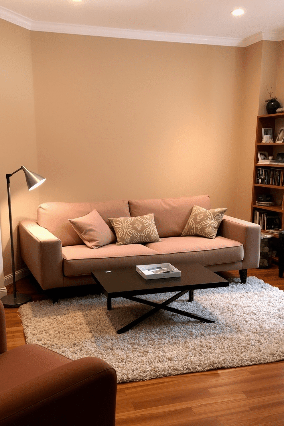 A cozy small family room features a stylish sofa bed that seamlessly blends comfort and functionality, perfect for accommodating guests. The walls are painted in a warm beige tone, complemented by soft lighting from a modern floor lamp, creating an inviting atmosphere. A plush area rug anchors the space, while a coffee table with a sleek design sits at the center, surrounded by decorative cushions in earthy tones. Shelves adorned with books and personal mementos line one wall, adding character and warmth to the room.