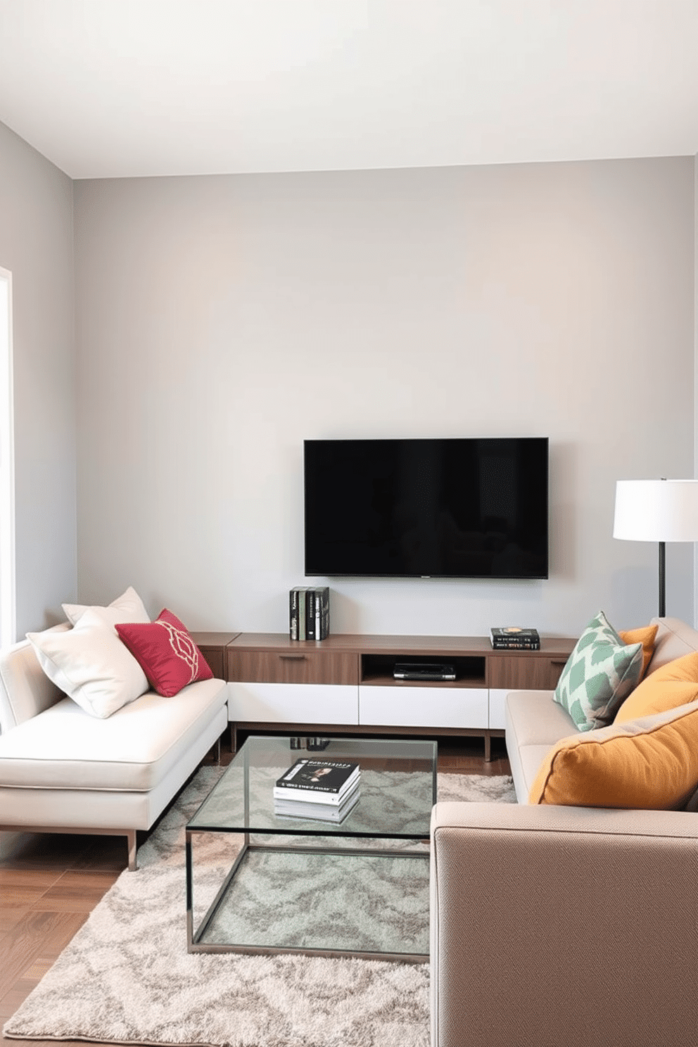 A modern small family room featuring a sleek floating TV unit mounted on a light gray wall, creating an illusion of more floor space. The room is accented with a cozy sectional sofa in soft beige, complemented by colorful throw pillows and a stylish area rug beneath a glass coffee table.