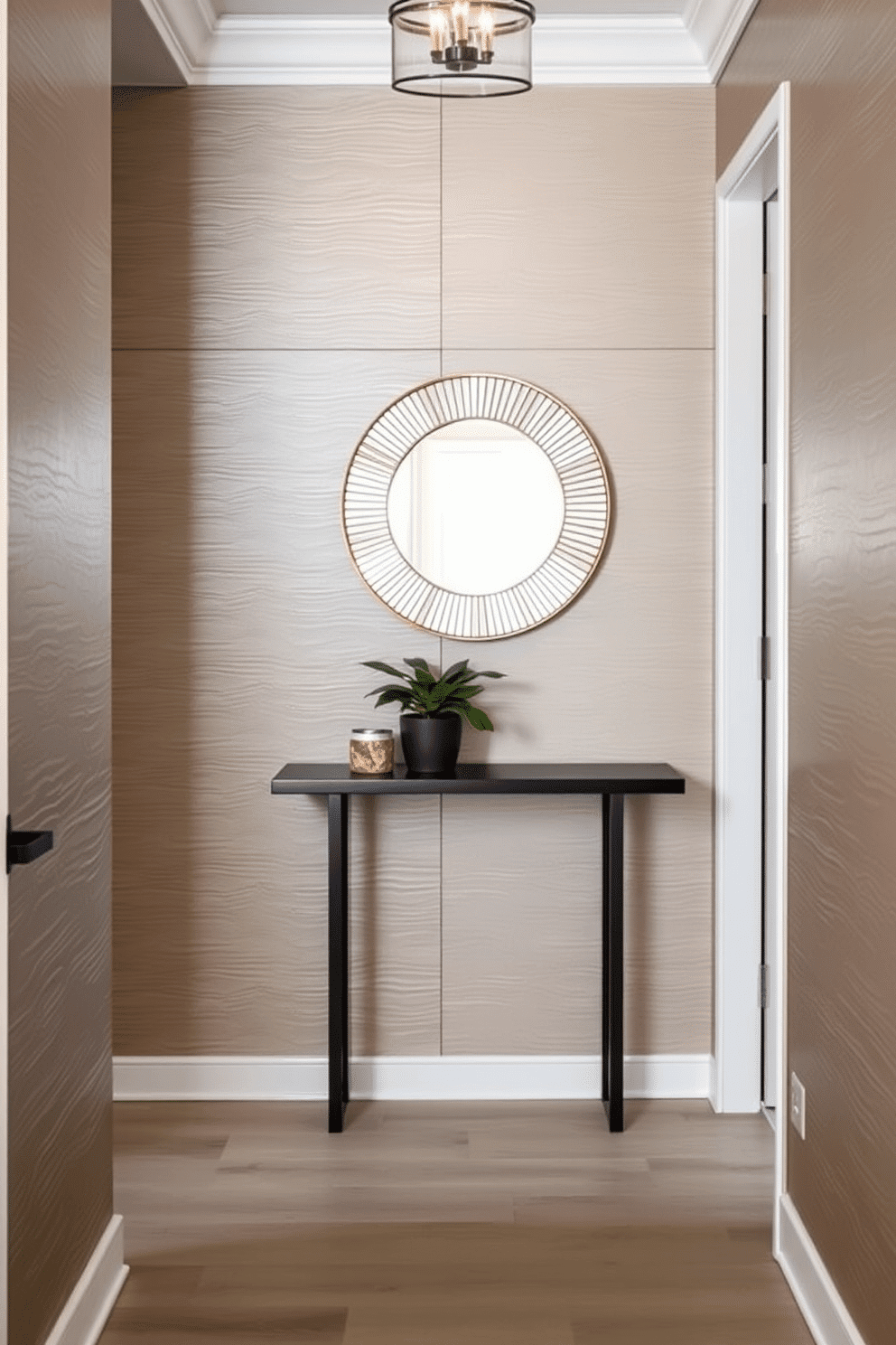 A stylish small foyer featuring textured wall panels that add depth and visual interest. The space is adorned with a sleek console table, a round mirror with a decorative frame, and a small potted plant for a touch of greenery.