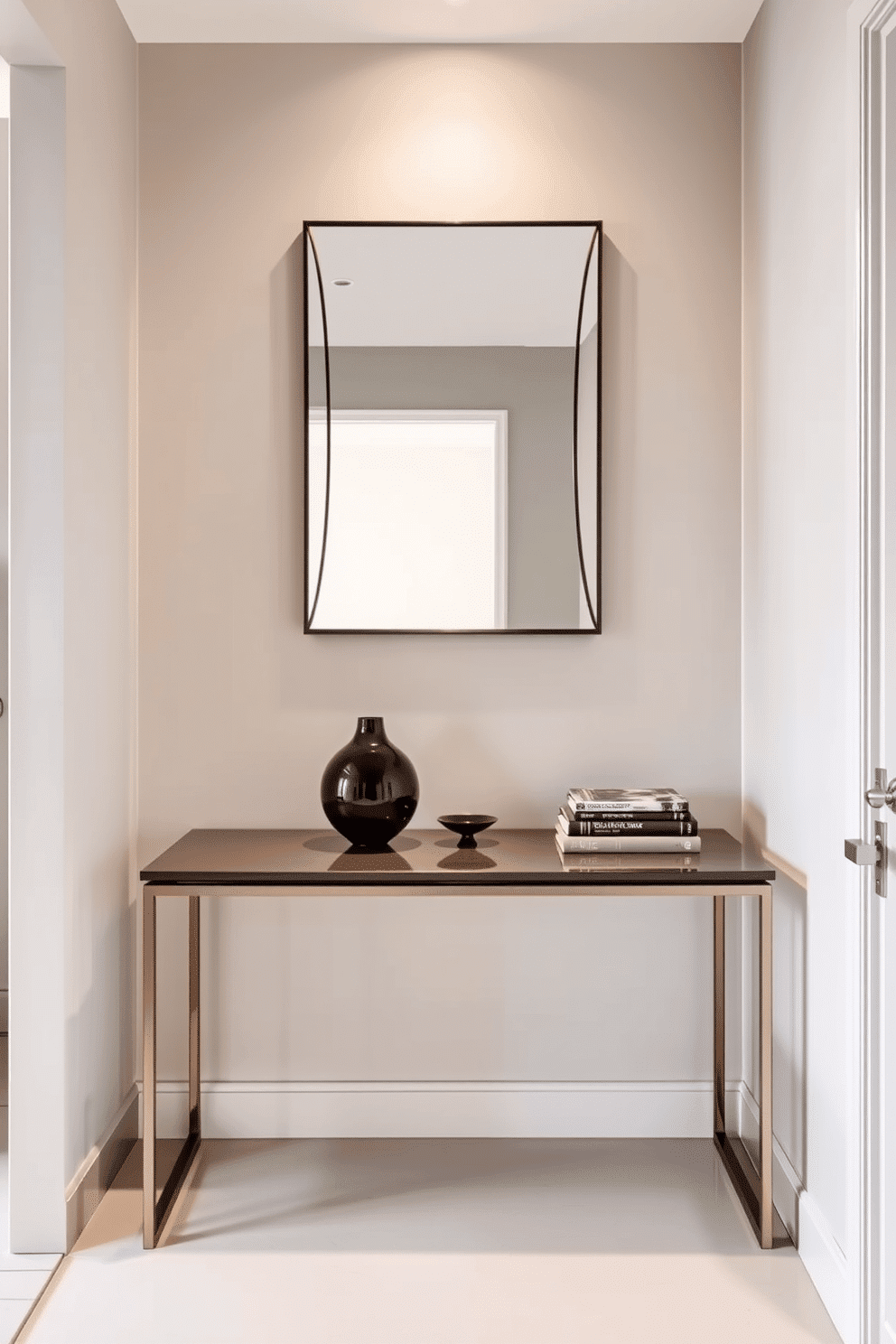 A sleek console table is positioned against the wall, featuring a glossy finish that reflects the soft lighting above. On the table, decorative accents such as a sculptural vase and a stack of art books add a touch of sophistication to the space. The small foyer is designed with a minimalist approach, incorporating a muted color palette that enhances the sense of openness. A stylish mirror hangs above the console table, creating an illusion of depth while providing a functional element for quick reflections.