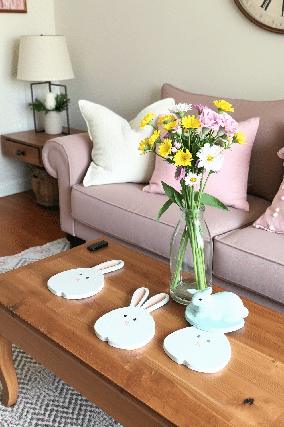 A cozy small living room decorated for Easter features bunny-shaped coasters placed on a rustic wooden coffee table. Soft pastel-colored cushions adorn a plush sofa, while a cheerful floral arrangement in a vase adds a touch of spring to the space.