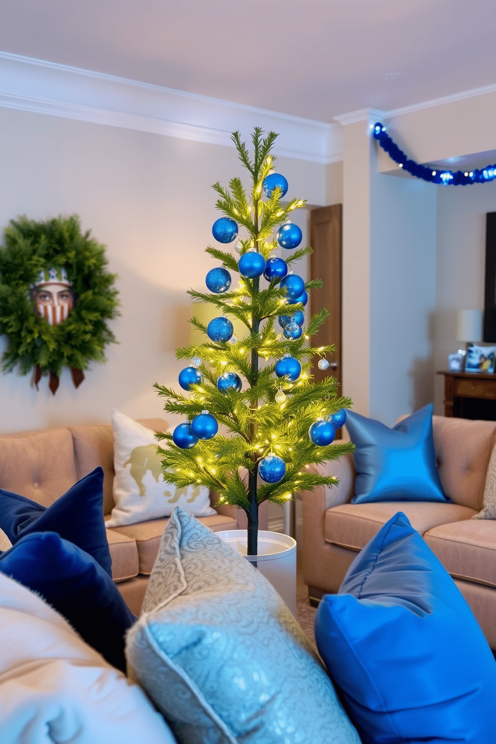 A cozy living room adorned for Hanukkah, featuring a miniature tree decorated with vibrant blue ornaments and twinkling lights. The space is filled with plush seating in soft fabrics, accented by cushions in shades of blue and silver, creating a warm and inviting atmosphere.