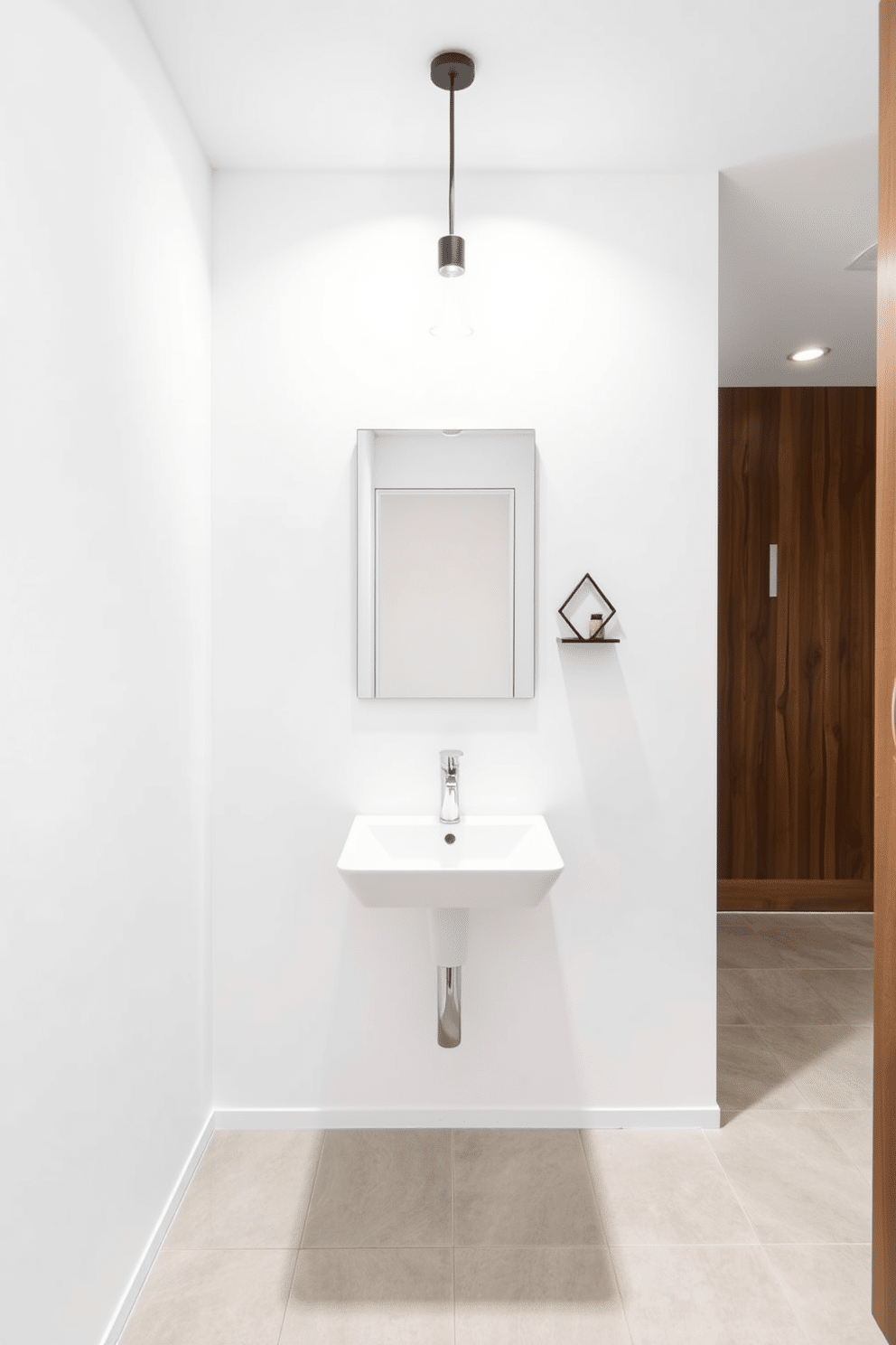 A minimalist powder room featuring a wall-mounted sink with a sleek, angular design and a simple, frameless mirror above it. The walls are painted in a crisp white, and the floor is adorned with large, light gray tiles, creating a sense of spaciousness. A single pendant light hangs from the ceiling, providing soft illumination while maintaining the uncluttered aesthetic. A small, geometric shelf holds a few essential decorative items, enhancing the room's modern appeal without overwhelming the space.