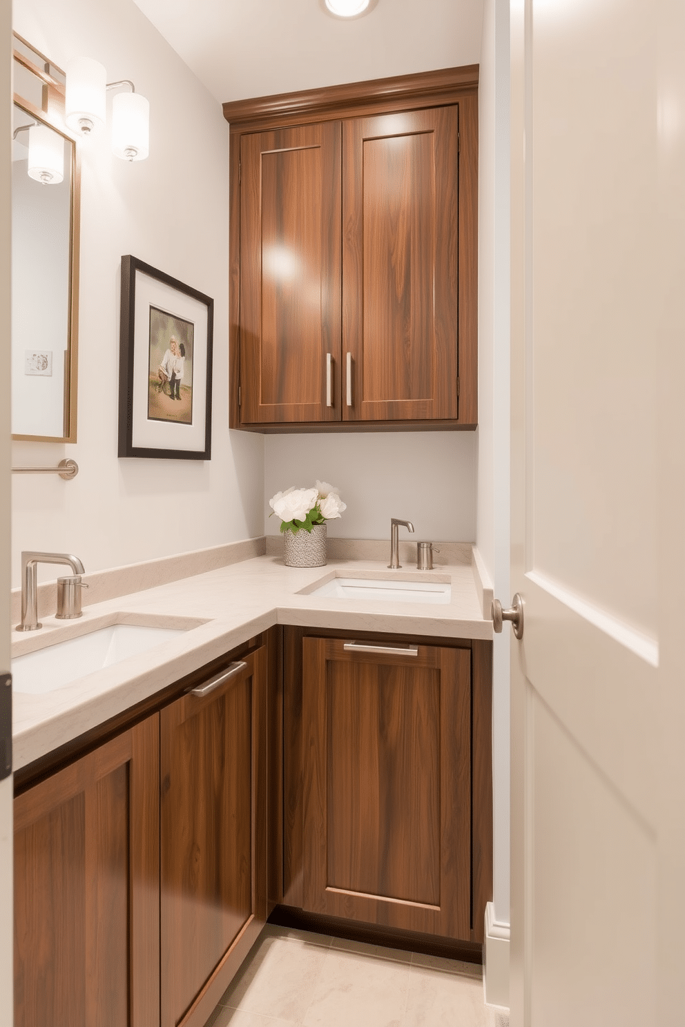 Custom cabinetry elevates the design of a small powder room, featuring sleek lines and a rich wood finish that complements the overall aesthetic. A stylish countertop with integrated sinks maximizes functionality while maintaining an elegant appearance, accented by modern fixtures in brushed nickel. The walls are adorned with a soft, neutral color palette, enhancing the sense of space, while decorative elements like framed art and a chic mirror add personality. Thoughtful lighting fixtures illuminate the area, creating a warm ambiance that invites guests to enjoy the refined atmosphere.