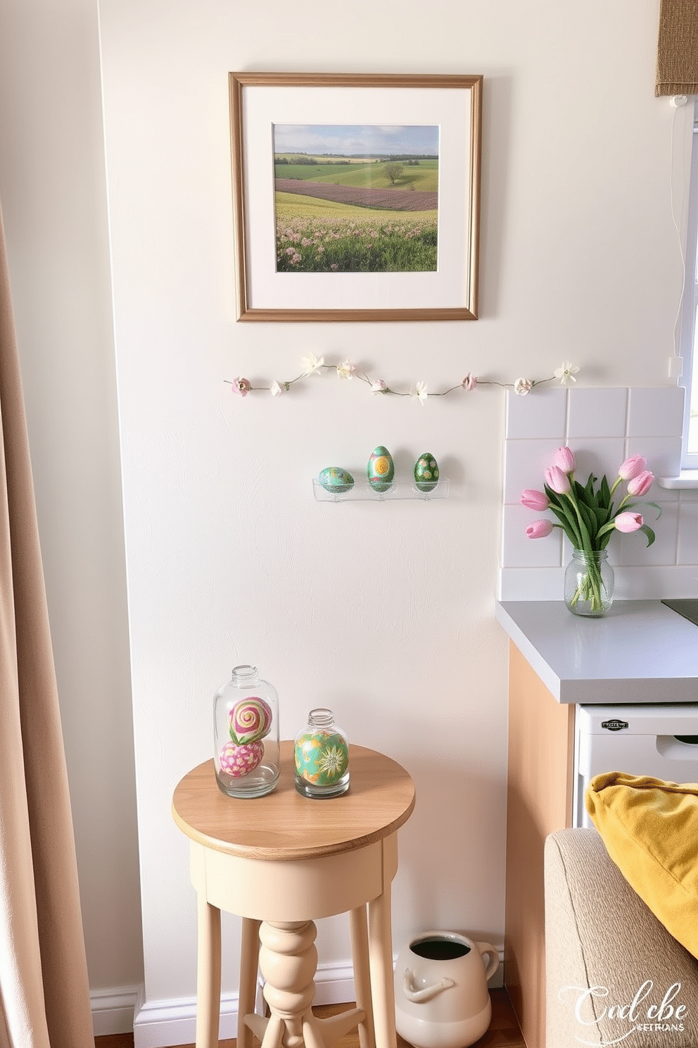 A cozy living room corner decorated for Easter. A small wooden side table holds two glass jars filled with colorful DIY painted eggs, each egg featuring intricate patterns and vibrant hues. The walls are painted in a soft pastel color, complementing the festive theme. Above the table, a framed picture of a spring landscape adds a touch of seasonal charm. A compact kitchen nook transformed for Easter celebrations. A white shelf displays several glass jars, each containing beautifully painted eggs with a mix of floral and geometric designs. The backsplash is adorned with a delicate garland of artificial flowers, enhancing the holiday spirit. A small vase with fresh tulips sits on the windowsill, bringing a burst of color to the space.