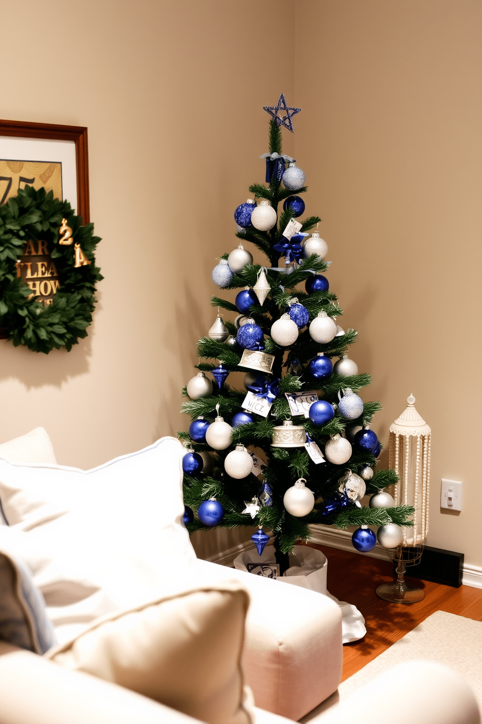 A small, elegantly decorated Hanukkah tree stands in the corner of a cozy living room. Adorned with personalized ornaments, the tree features a mix of blue and silver decorations that reflect the festive spirit. The surrounding space is thoughtfully arranged to maximize comfort and style. Soft, warm lighting illuminates the area, creating an inviting atmosphere for family gatherings during the holiday season.