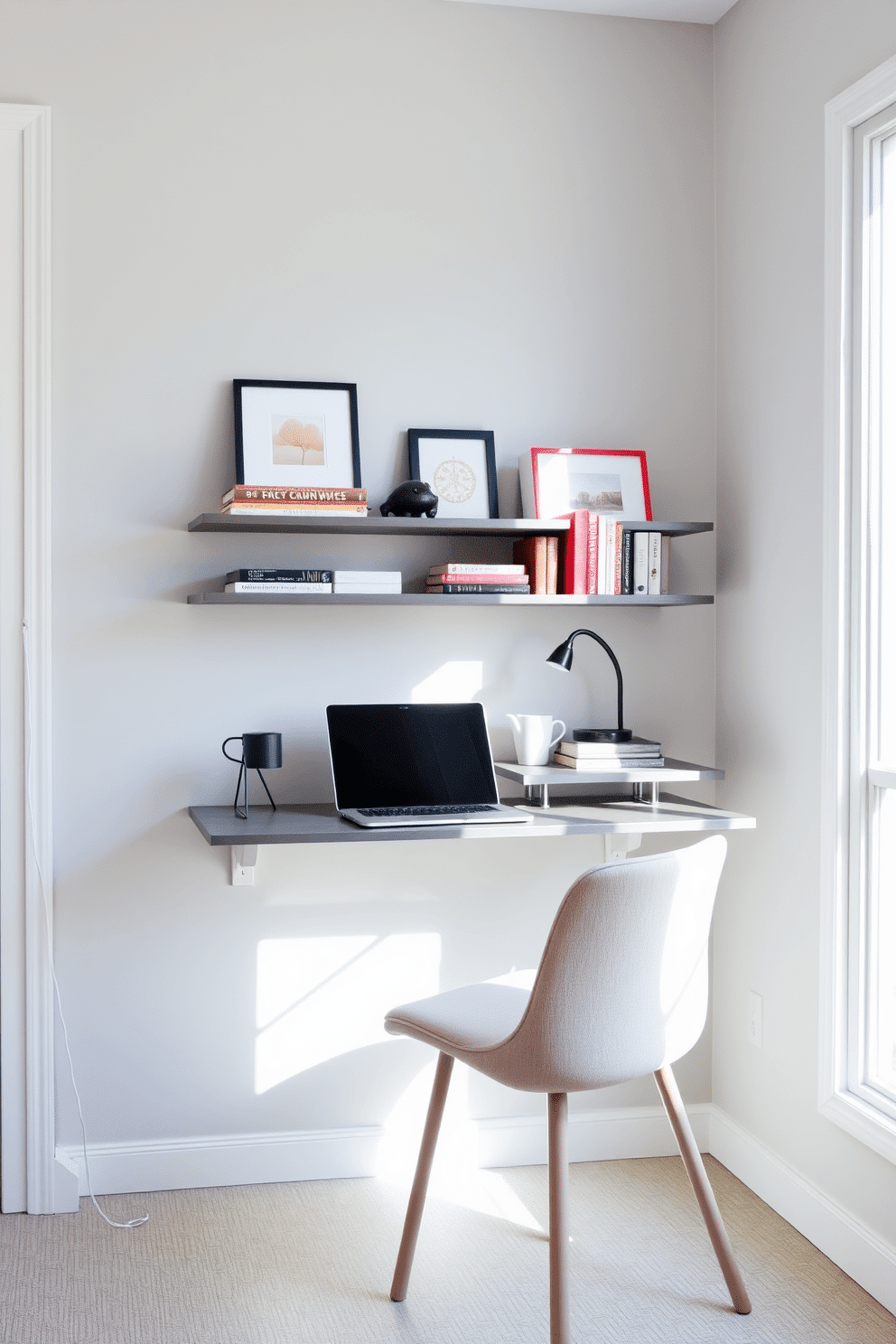 A sleek wall-mounted desk is positioned against a light gray wall, maximizing floor space while providing a functional workspace. Above the desk, floating shelves display books and decorative items, adding both style and storage to the small study room. The room features a comfortable chair with a minimalist design, upholstered in a soft fabric that complements the overall color scheme. Natural light floods in through a nearby window, illuminating the space and creating an inviting atmosphere for productivity.