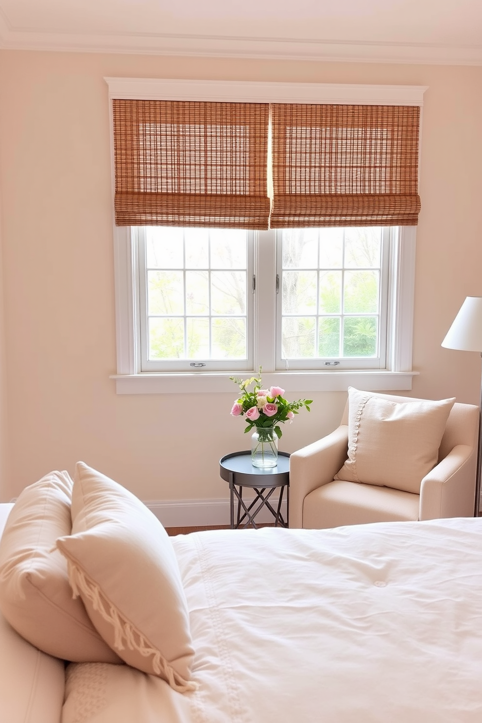 A serene bedroom setting featuring bamboo shades that gently filter natural light, creating a warm and inviting atmosphere. The walls are painted in soft pastel hues, complemented by light, airy bedding and decorative pillows that reflect the colors of spring. Incorporate fresh flowers and greenery to enhance the seasonal vibe, adding a touch of nature to the decor. A cozy reading nook with a plush chair and a small side table completes the tranquil space, inviting relaxation and comfort.