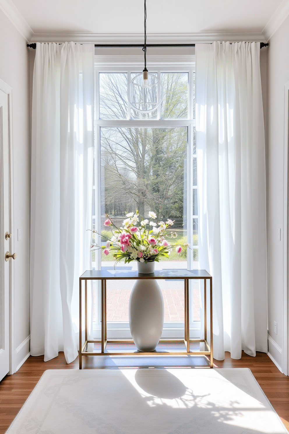 A bright and airy entryway featuring breezy white curtains that gracefully frame a large window, allowing natural light to flood the space. The floor is adorned with a soft pastel rug, and a stylish console table holds fresh spring flowers in a ceramic vase, welcoming guests with a touch of seasonal charm.