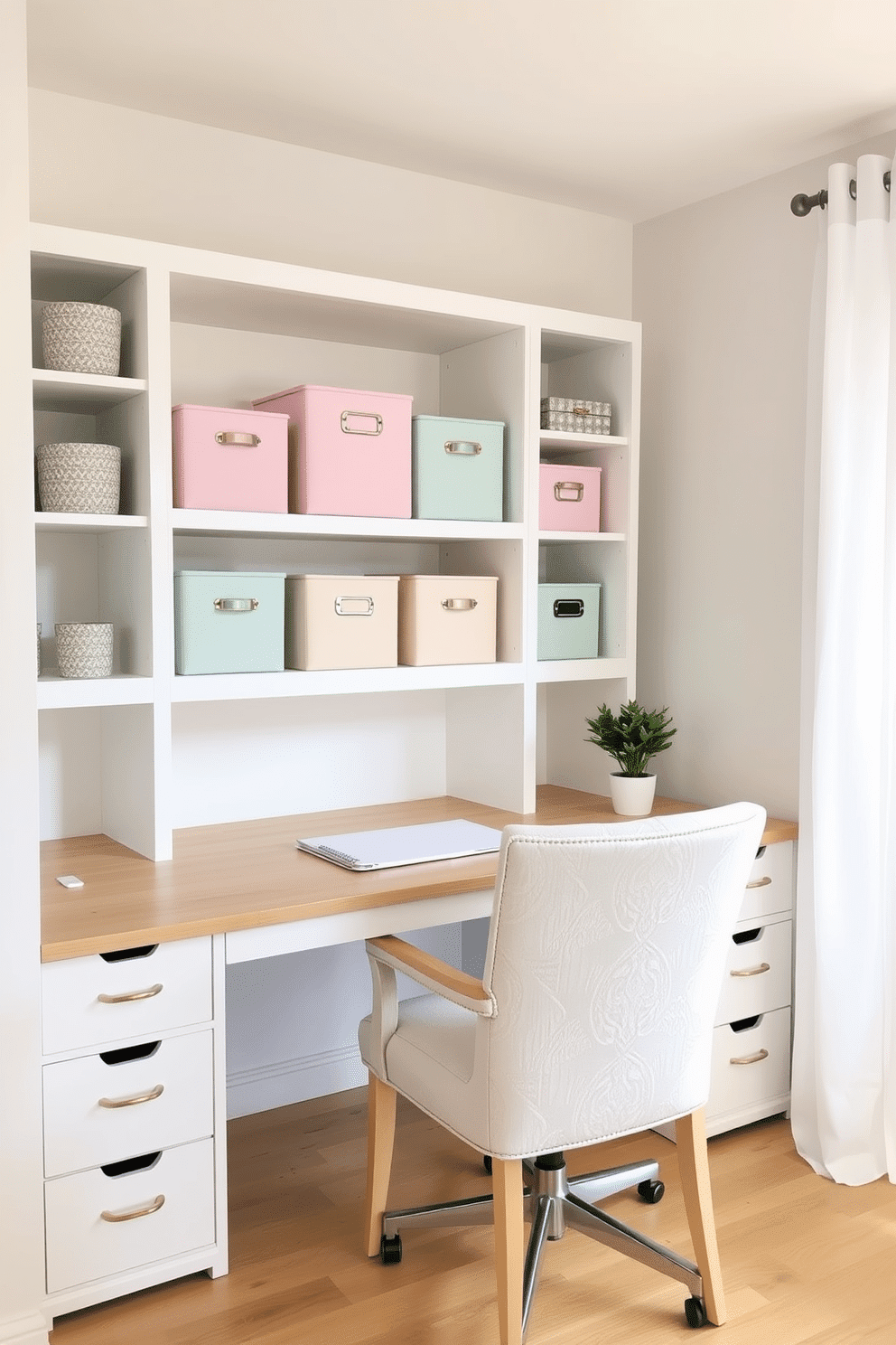 A bright and inviting home office featuring decorative storage boxes in soft pastel colors arranged neatly on a white shelving unit. The desk is minimalist with a light wood finish, complemented by a comfortable chair in a light fabric, and a small potted plant adds a touch of greenery to the workspace.