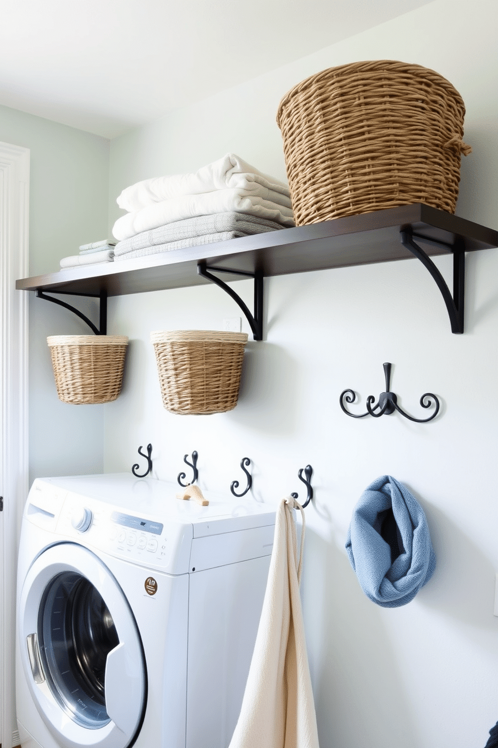 A bright and airy laundry room features decorative hooks mounted on the wall for hanging clothes and accessories. The walls are painted in a soft pastel color, and a stylish shelf above the hooks displays neatly folded towels and decorative baskets.