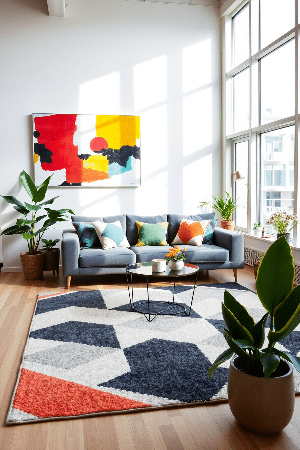 A bright and airy loft space features geometric patterned throw pillows in vibrant colors on a sleek gray sofa. The walls are adorned with abstract art that highlights the geometric theme, while a large area rug with a bold geometric design anchors the seating area. Natural light floods the room through large windows, enhancing the cheerful spring vibe. Potted plants with sculptural shapes are strategically placed around the space, adding a fresh touch to the decor.