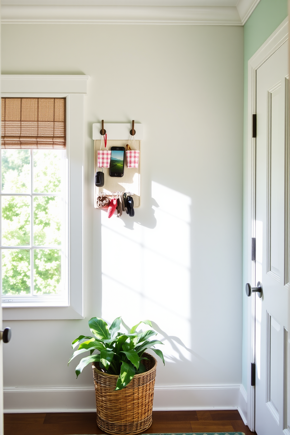 A bright and inviting mudroom features a hanging organizer mounted on the wall for small items like keys and gloves. Natural light floods the space through a nearby window, highlighting a cheerful color palette of soft pastels and fresh greenery.