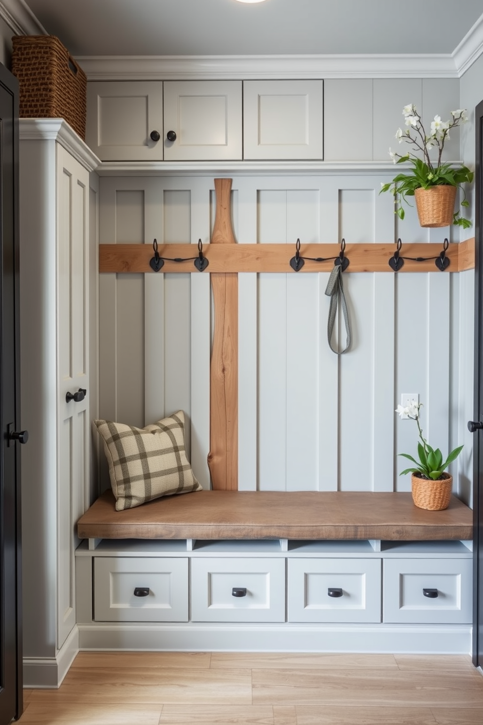 A stylish mudroom featuring a functional shoe storage solution with built-in cabinetry that blends seamlessly into the decor. The space is adorned with light gray walls and rustic wooden accents, creating a warm and inviting atmosphere. A bench with soft cushions sits in front of the shoe storage, offering a comfortable spot to sit while putting on or taking off shoes. Potted plants and decorative hooks line the walls, adding a touch of spring freshness to the overall design.