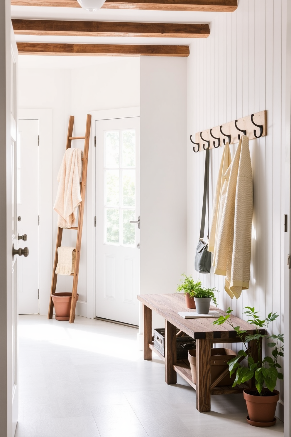 A bright and welcoming mudroom filled with natural light. The space features a decorative ladder leaning against the wall, adorned with neatly folded towels in soft pastel colors. The walls are painted in a crisp white hue, creating a fresh and airy atmosphere. A rustic wooden bench sits below a row of hooks, perfect for hanging jackets and bags, while potted plants add a touch of greenery.