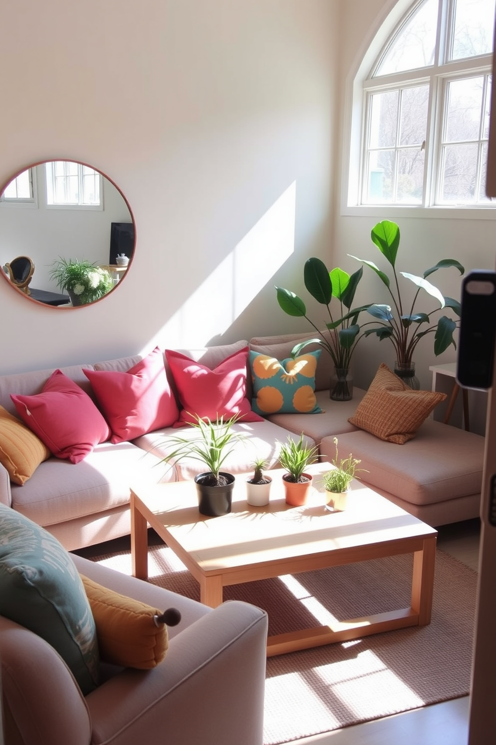 A small living room filled with natural light. The walls are painted in a soft pastel hue, and a large round mirror hangs on one wall, reflecting the sunlight. A cozy seating area features a plush sofa adorned with colorful throw pillows. A light wooden coffee table sits in the center, surrounded by potted plants that bring a touch of spring indoors.