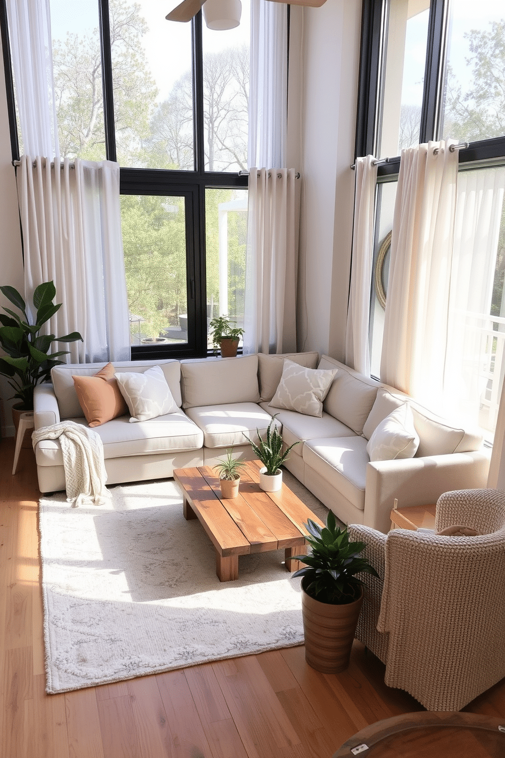 A light-colored sectional sofa is the centerpiece of a cozy and inviting small living room. Surrounding the sofa are soft pastel accents, including throw pillows and a light area rug that add warmth and comfort. Natural light floods the space through large windows adorned with sheer curtains. A small coffee table made of reclaimed wood sits in front of the sofa, complemented by a few potted plants that bring life to the room.