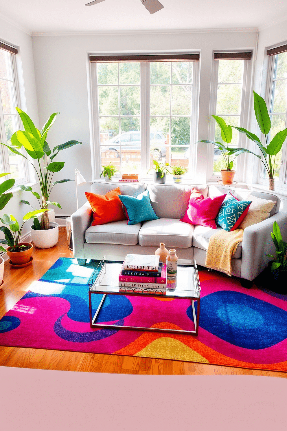 A bright and inviting small living room features a cozy seating arrangement with a light gray sofa adorned with colorful throw pillows. A cheerful area rug in vibrant hues anchors the space, adding warmth and texture to the hardwood floor. Natural light streams in through large windows, illuminating the room and highlighting the fresh green plants placed strategically around the space. A stylish coffee table sits at the center, adorned with a few art books and a decorative tray for a touch of personality.