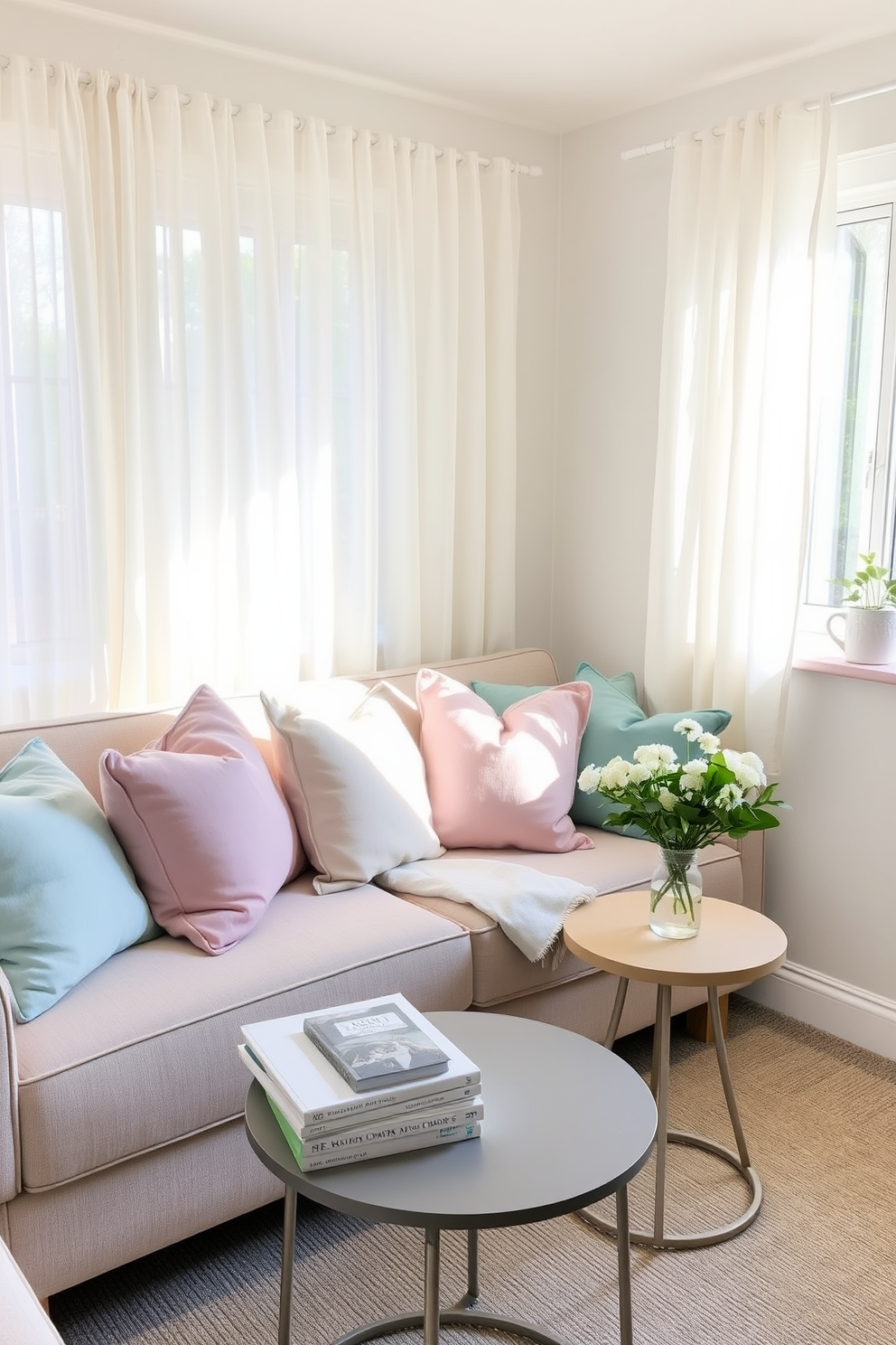 A cozy living room featuring a small sofa adorned with an array of pastel-colored throw pillows in soft pinks, blues, and greens. The space is brightened by natural light streaming through sheer curtains, creating a fresh and inviting atmosphere. In one corner, a small round coffee table holds a stack of design books and a delicate vase with fresh flowers. The walls are painted in a light neutral tone, enhancing the airy feel of the room while allowing the pastel accents to pop.