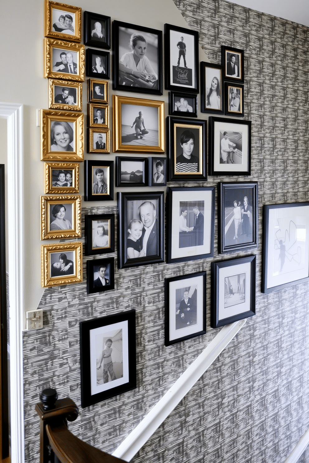 A striking photo collage adorns the wall, featuring an eclectic mix of frame sizes and styles, from ornate gold to sleek black. The arrangement is curated to create a dynamic visual flow, with family portraits and abstract art interspersed to tell a story. The staircase wall is transformed into a stunning focal point with a combination of textured wallpaper and strategically placed artwork. Soft lighting highlights the pieces, creating an inviting atmosphere that enhances the architectural lines of the staircase.