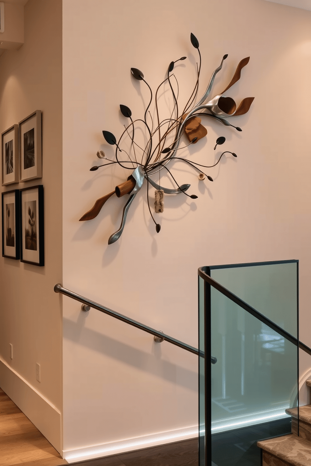 Sculptural wall art for three-dimensional interest. The piece features organic shapes and flowing lines, crafted from a mix of materials like metal and wood, creating a dynamic focal point that draws the eye. Staircase wall design ideas. The wall is adorned with a series of framed artworks and a sleek handrail, complemented by ambient lighting that highlights the textures and colors of the staircase, enhancing the overall aesthetic of the space.