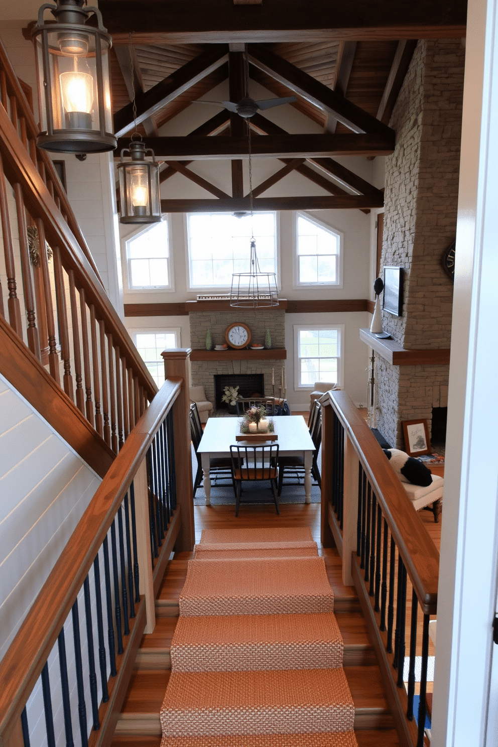 A rustic farmhouse staircase made of reclaimed wood features sturdy railings and is illuminated by vintage lanterns hanging from the ceiling. The surrounding walls are adorned with shiplap, and a woven runner adds warmth and texture to the steps. The staircase leads into a cozy dining room, where a large farmhouse table is surrounded by mismatched chairs. Natural light floods the space through oversized windows, highlighting the rustic charm of exposed beams and a stone fireplace.