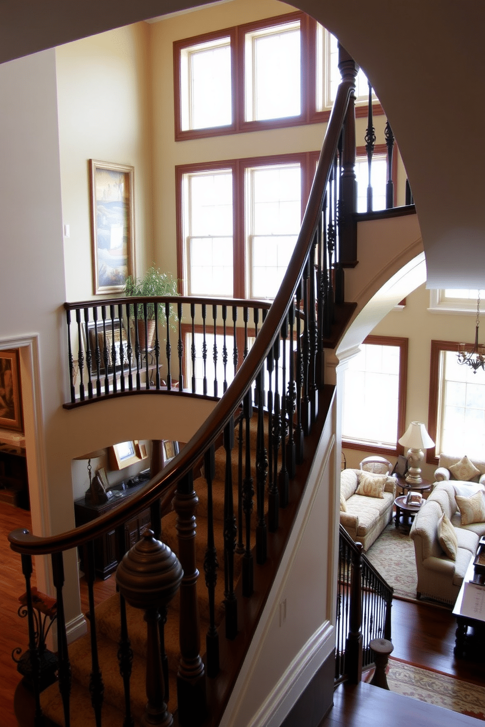 A classic staircase with decorative balusters gracefully winds up through the family room, creating a focal point that exudes elegance. The balusters are intricately designed, featuring a blend of wood and wrought iron, while the staircase is adorned with a rich, polished finish that complements the room's overall aesthetic. In the family room, the staircase is framed by warm, inviting colors and plush furnishings, enhancing the cozy atmosphere. Large windows allow natural light to flood the space, highlighting the craftsmanship of the staircase and the beautiful decor surrounding it.