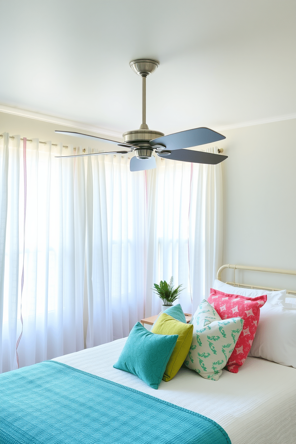 A serene summer bedroom setting with a ceiling fan installed to enhance airflow. The room features light, airy curtains that flutter gently with the breeze, creating a refreshing atmosphere. The walls are painted in a soft pastel hue, complemented by a cozy bed adorned with colorful throw pillows and a lightweight quilt. A bedside table holds a small potted plant and a stylish lamp, adding a touch of greenery and warmth to the space.