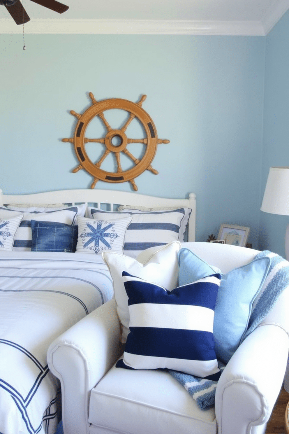 A serene summer bedroom decorated with nautical elements. The walls are painted a soft blue, reminiscent of the ocean, and the bedding features a crisp white and navy striped pattern. A vintage wooden ship wheel is mounted above the headboard, adding a touch of maritime charm. Nautical-themed throw pillows in various shades of blue and white are arranged on a cozy, oversized armchair in the corner.