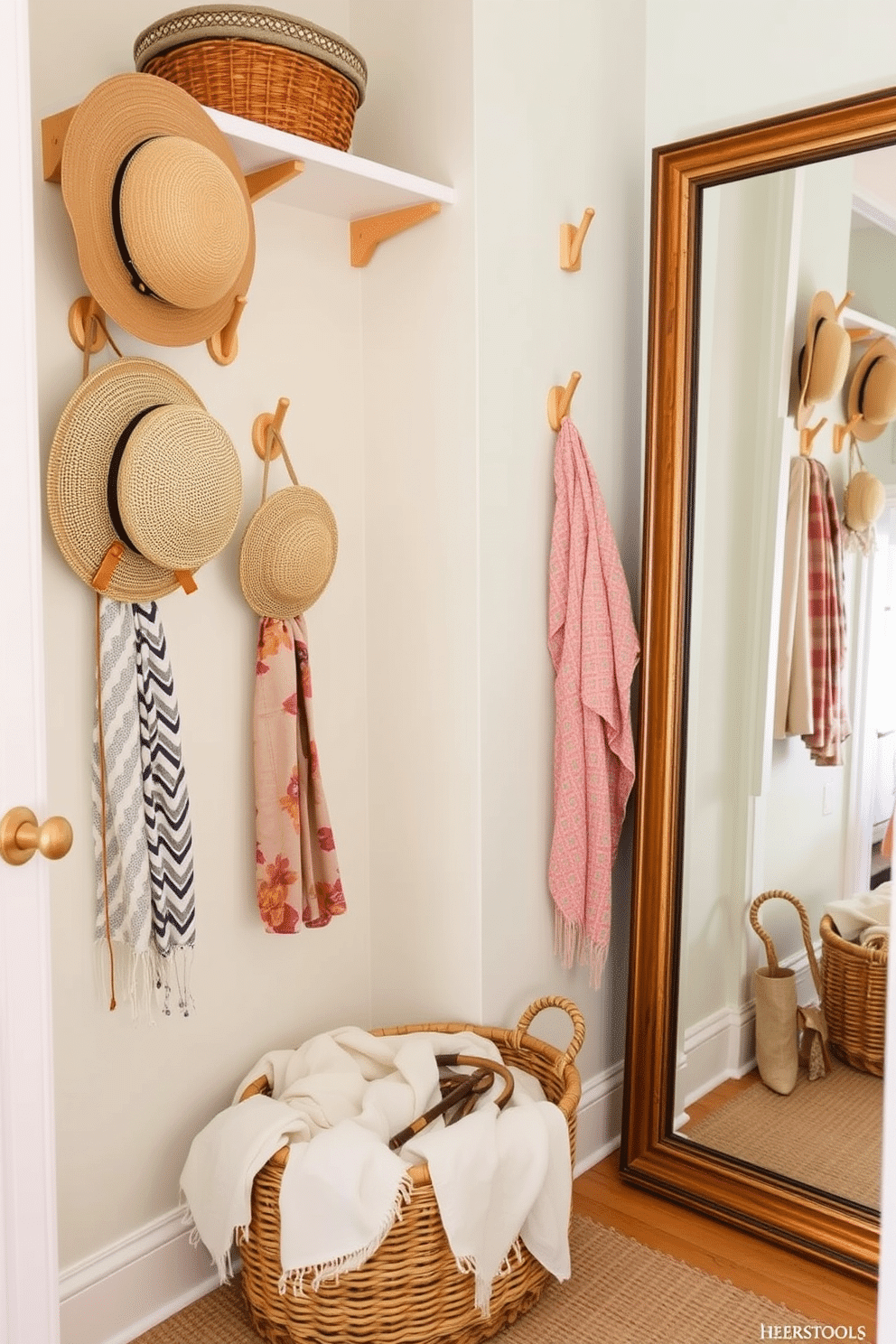 A bright and airy summer closet designed for functionality and style. The walls are painted in a soft pastel hue, and decorative hooks made of natural wood are mounted at varying heights for easy access to hats and accessories. A woven basket sits on the floor, filled with lightweight summer scarves and accessories. A full-length mirror is positioned on one side, reflecting the organized and inviting space.