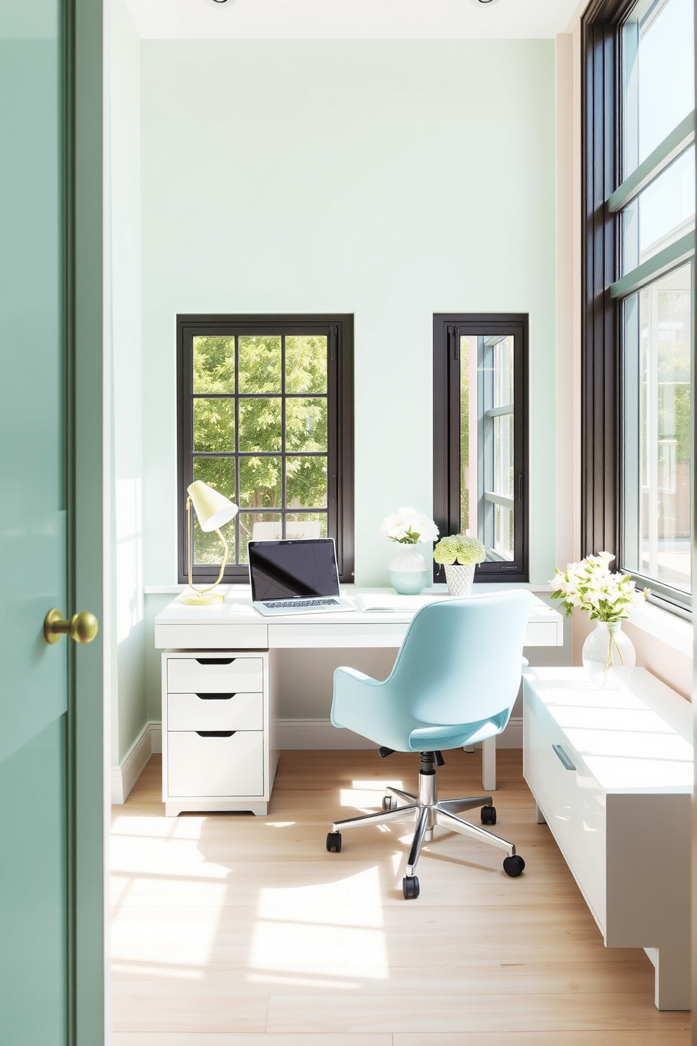 A bright and airy home office filled with natural light. The walls are painted in soft pastel shades of mint green and pale pink, creating a cheerful atmosphere. A sleek white desk is positioned near a large window, adorned with a stylish pastel blue chair. Decorative elements like a pastel yellow lamp and a floral arrangement add a touch of freshness to the workspace.