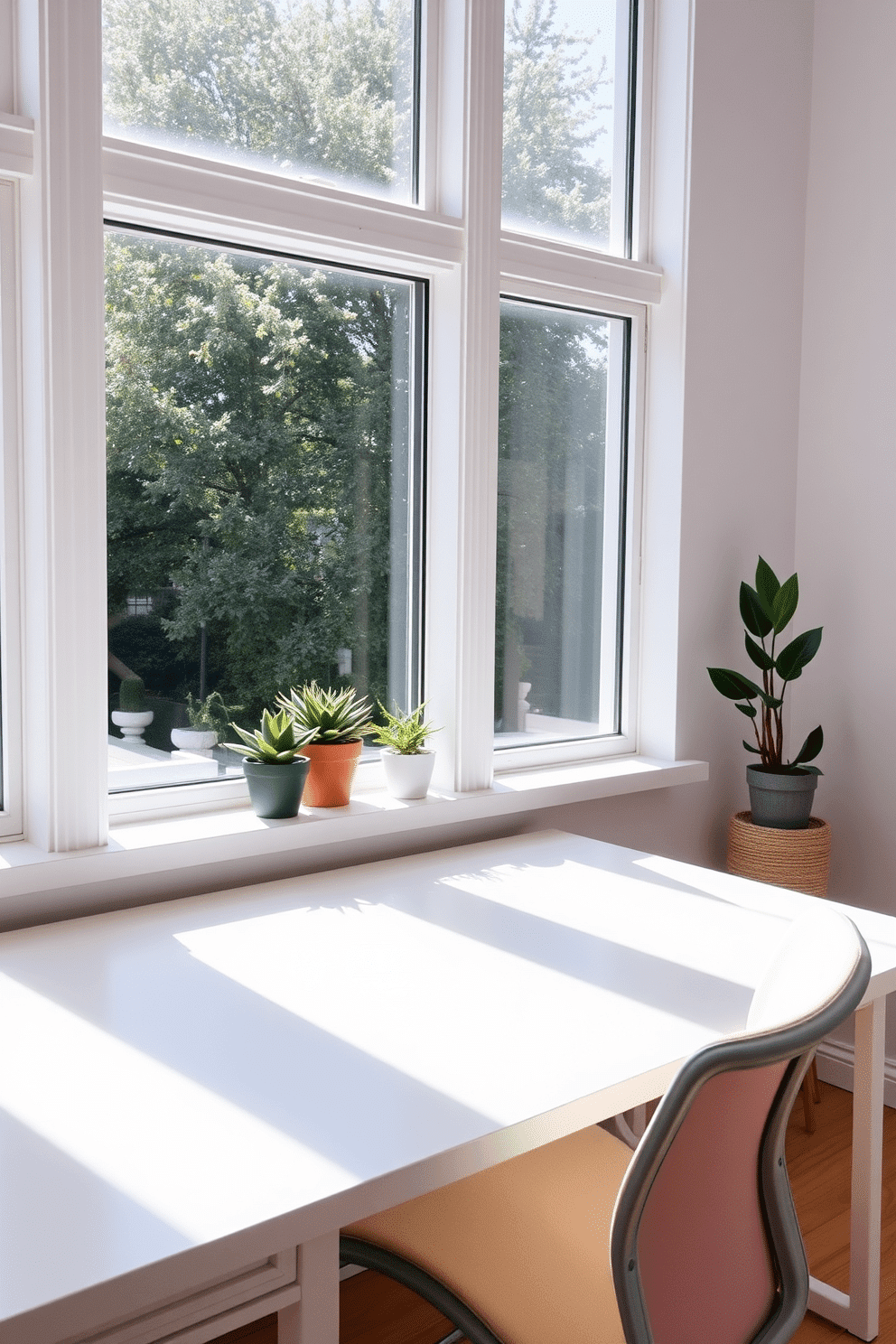 A minimalist desk design features a sleek white surface with clean lines and no visible clutter. The desk is paired with a simple ergonomic chair in a soft beige fabric, creating a serene workspace. Natural light floods the room through large windows, illuminating the space with a warm glow. A few potted plants are placed on the windowsill, adding a touch of greenery and freshness to the home office.