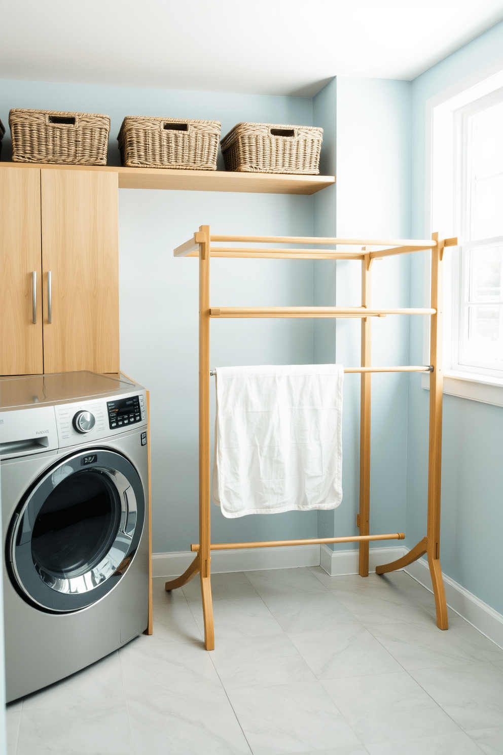 A bright and airy laundry room featuring a spacious drying rack made of natural wood positioned near a large window. The walls are painted in a soft pastel blue, and the floor is adorned with light gray tiles for a fresh and modern look. To the left, a stylish washing machine is paired with a matching dryer, both encased in sleek cabinetry. Decorative baskets are neatly arranged on a shelf above the drying rack, providing both functionality and a touch of charm.