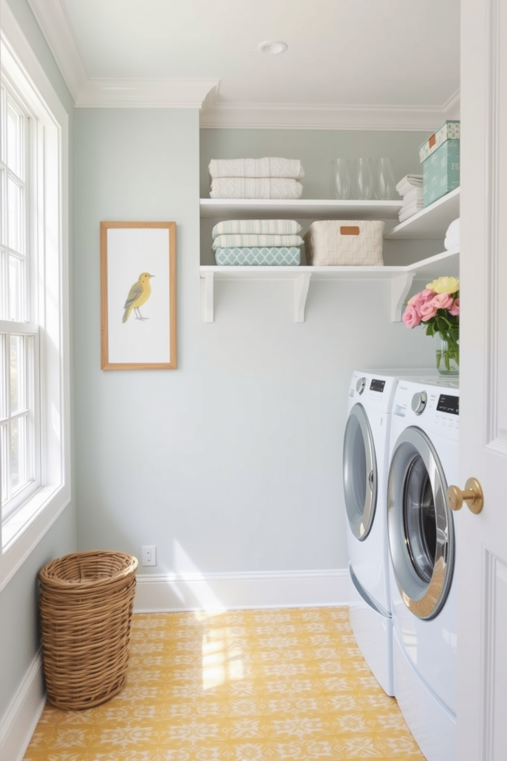 A bright and airy laundry room featuring a small wooden bench for seating, positioned near a large window that lets in natural light. The walls are painted a soft pastel color, and the floor is adorned with cheerful patterned tiles, creating an inviting atmosphere. In the corner, a stylish laundry basket complements the decor, while shelves above the washer and dryer display neatly folded linens and decorative storage bins. Fresh flowers in a vase add a touch of warmth, making this laundry room both functional and aesthetically pleasing.