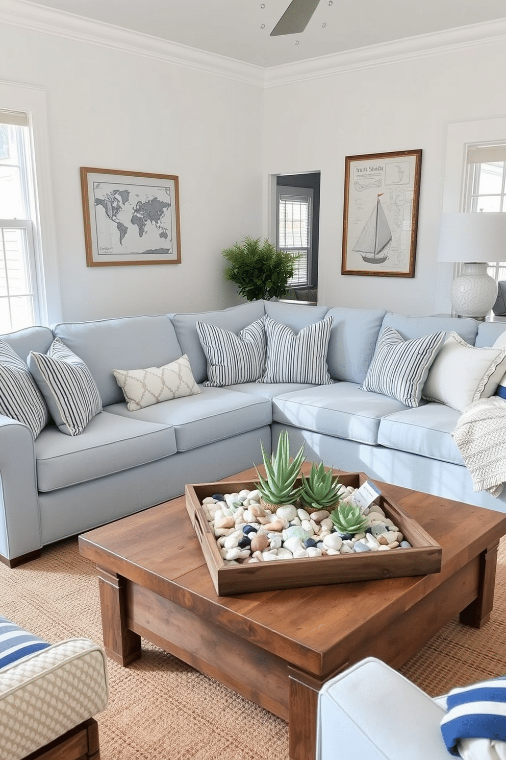 A bright summer living room filled with nautical-themed decor. The space features a large, comfortable sectional sofa upholstered in light blue fabric, accented with striped throw pillows in shades of navy and white. On the walls, framed vintage nautical maps and seashell art create a coastal atmosphere. A reclaimed wood coffee table sits in the center, adorned with a decorative tray holding a collection of sea glass and a small potted succulent.