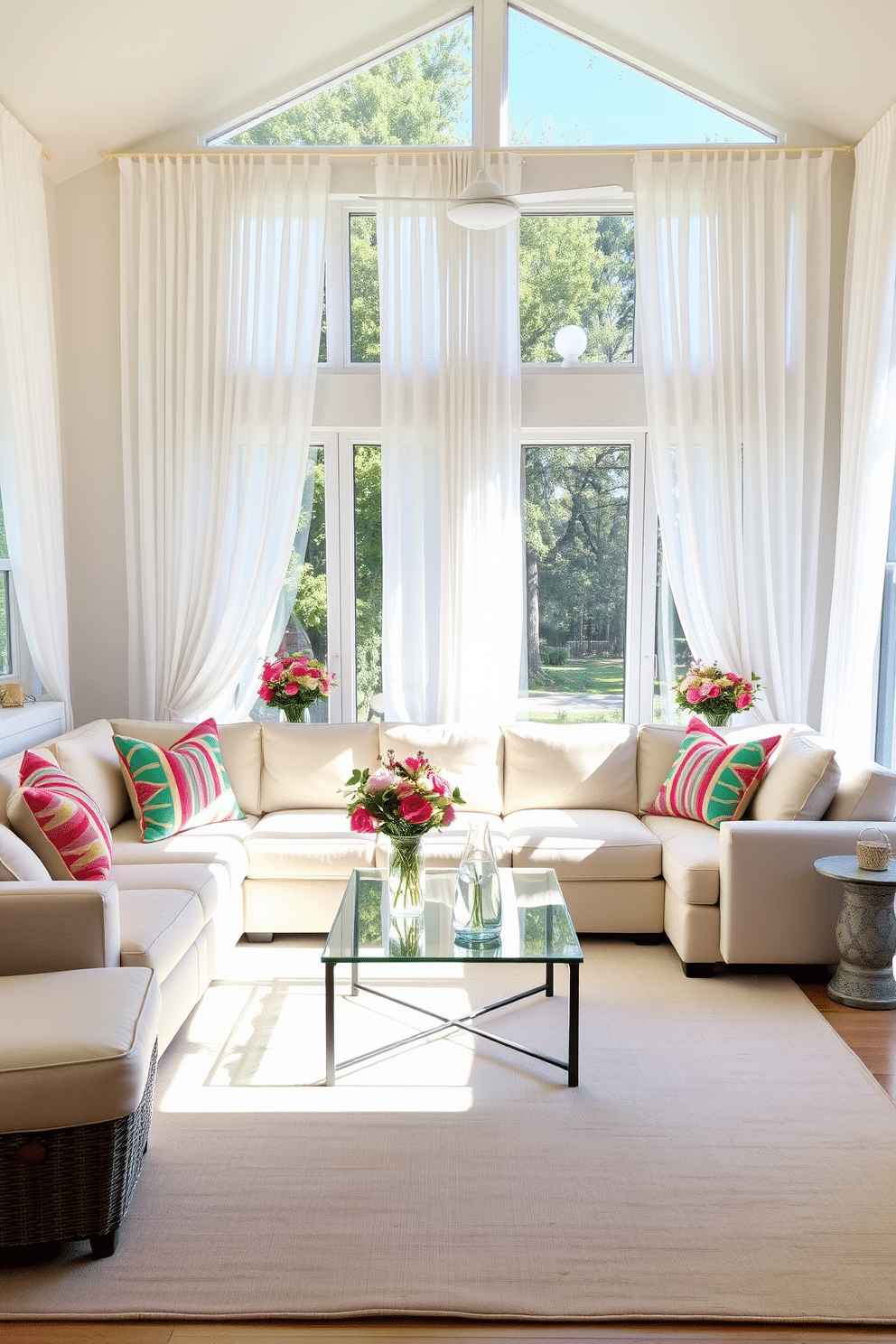 A bright and airy summer living room filled with natural light. The space features large windows draped with sheer white curtains that gently flutter in the breeze. A comfortable sectional sofa in a soft pastel hue is adorned with vibrant throw pillows. A glass coffee table sits in the center, reflecting the sunlight and adding an elegant touch to the room. Decorative glass vases in varying heights are placed on the mantel, filled with fresh seasonal flowers. A large area rug in a light color anchors the seating area, enhancing the overall warmth and inviting atmosphere.