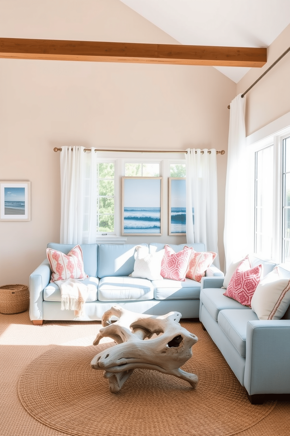 A bright and airy summer living room featuring a soft blue sofa adorned with white and coral accent pillows. Large windows let in natural light, and sheer white curtains flutter gently in the breeze. The walls are painted in a light sandy beige, creating a warm backdrop for coastal-themed artwork. A woven jute rug anchors the space, while a driftwood coffee table adds a rustic touch.