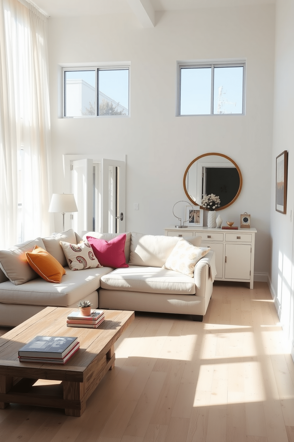 A bright and airy summer loft filled with natural light. Large windows draped with sheer white curtains allow sunlight to flood the space. A cozy seating area features a light-colored sectional sofa adorned with vibrant throw pillows. A rustic wooden coffee table sits in front, topped with a few art books and a small succulent. Mirrors are strategically placed on the walls to reflect the light and create an illusion of more space. A large round mirror hangs above a console table, enhancing the loft's open feel. The walls are painted in a soft pastel hue, complementing the light wood flooring. Decorative wall art adds personality and charm to the minimalist decor.