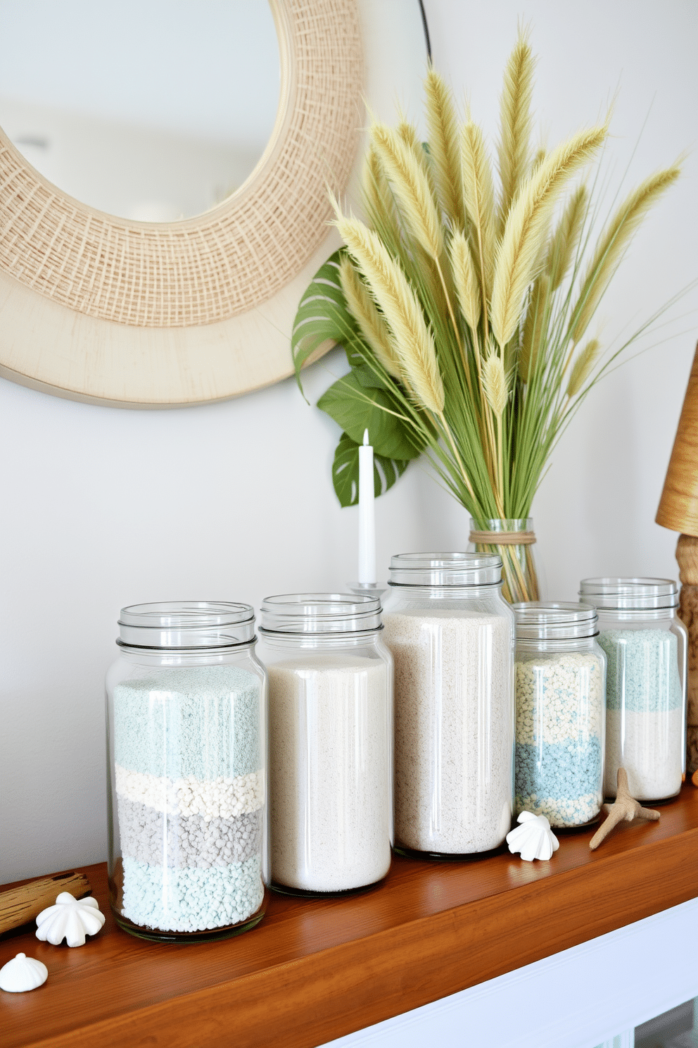 A stylish summer mantel decorated with glass jars filled with beach sand. The jars are arranged in varying heights, showcasing the textures of the sand, and complemented by small seashells and driftwood accents.