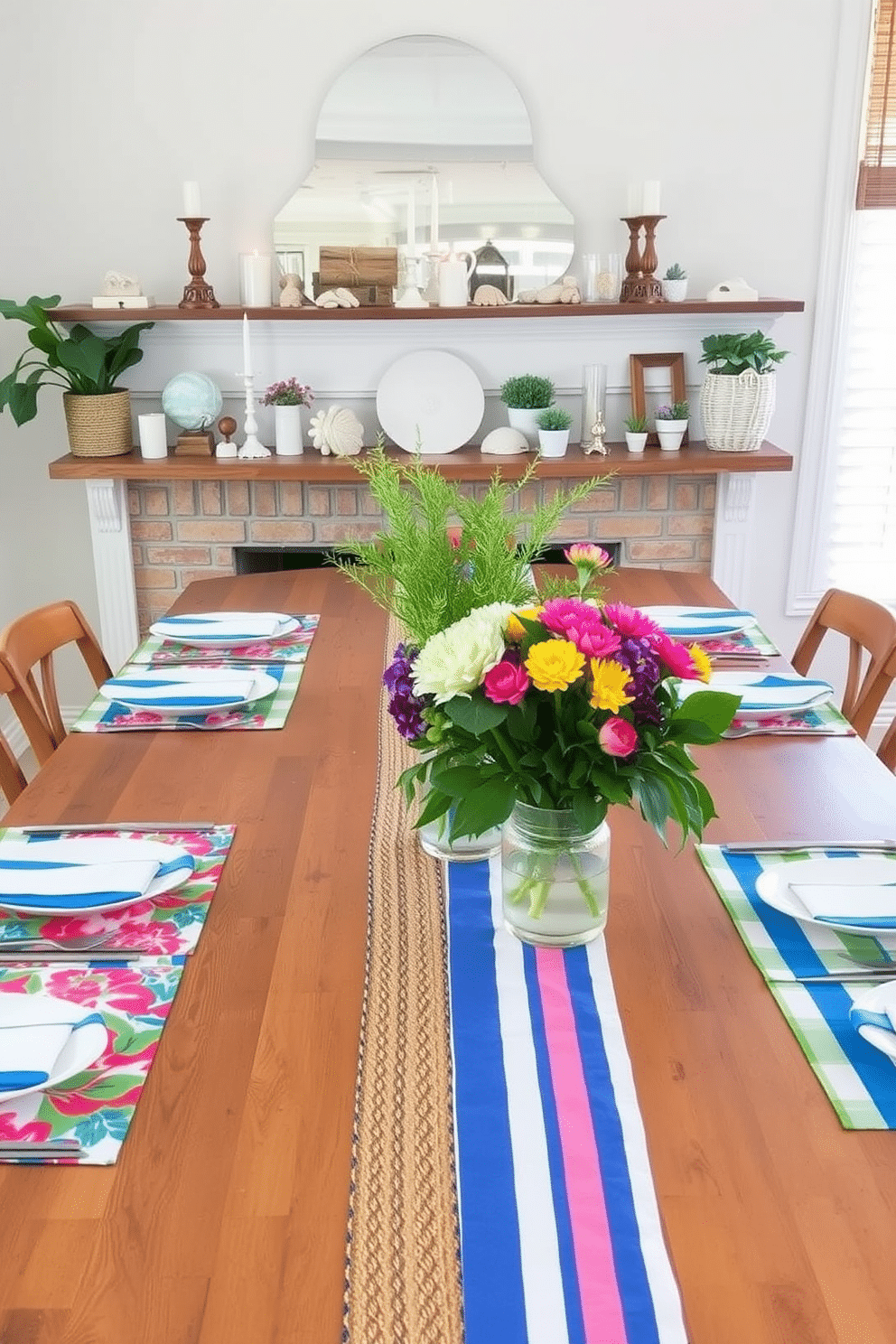 Bright table runners in vibrant colors adorn a long wooden dining table set for a summer gathering. The runners feature bold patterns of florals and stripes, adding a cheerful touch to the overall decor. The mantel is decorated with an assortment of summer-themed accents, including seashells, candles, and small potted plants. Fresh greenery and colorful flowers are arranged in a vase, bringing a lively and inviting atmosphere to the space.