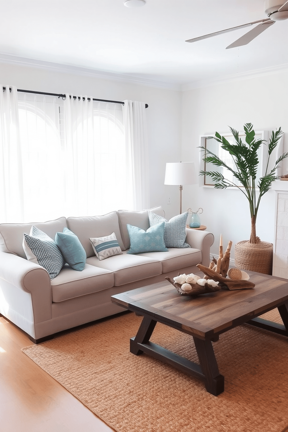 A cozy living room infused with beach-themed accessories. Soft blue throw pillows adorn a light beige sofa, while a woven jute rug anchors the space. Seashells and driftwood art pieces are displayed on a rustic coffee table. A large window with sheer white curtains allows natural light to flood the room, enhancing the airy atmosphere.