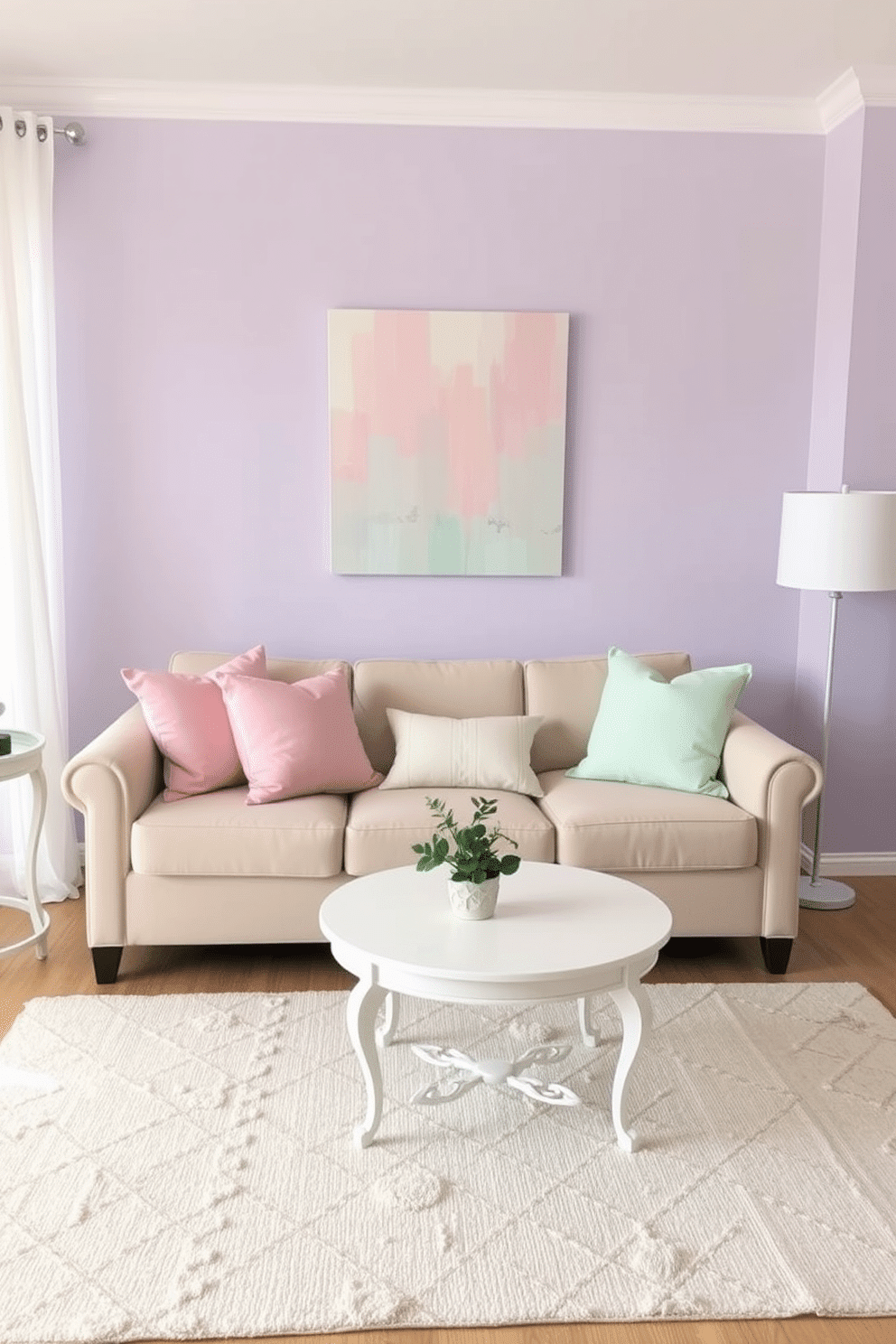 A cozy living room featuring light pastel colors throughout the decor. Soft pink and mint green cushions adorn a light beige sofa, while a delicate white coffee table sits in the center. The walls are painted a soft lavender, creating a calming atmosphere. A small potted plant adds a touch of freshness to the space, and a pastel abstract painting hangs above the sofa.