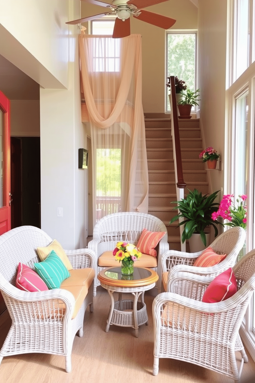 A bright and airy landing features elegant wicker furniture, including a cozy loveseat and two matching armchairs. The space is adorned with colorful cushions and a small round coffee table, creating a welcoming atmosphere. The staircase is decorated with summer-themed accents, such as vibrant potted plants and a flowing, sheer curtain draped over the bannister. Soft, natural lighting enhances the cheerful ambiance, inviting guests to relax and enjoy the view.