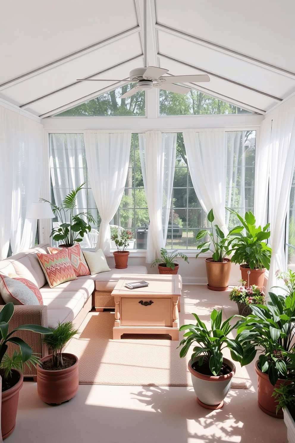 A bright and airy sunroom filled with natural light. There is a comfortable seating area with a plush sectional sofa adorned with colorful throw pillows and a large coffee table with storage in the center. Surrounding the seating are large windows draped with sheer white curtains that flutter gently in the breeze. Potted plants in various sizes are placed throughout the room, bringing a touch of greenery and a refreshing summer vibe.